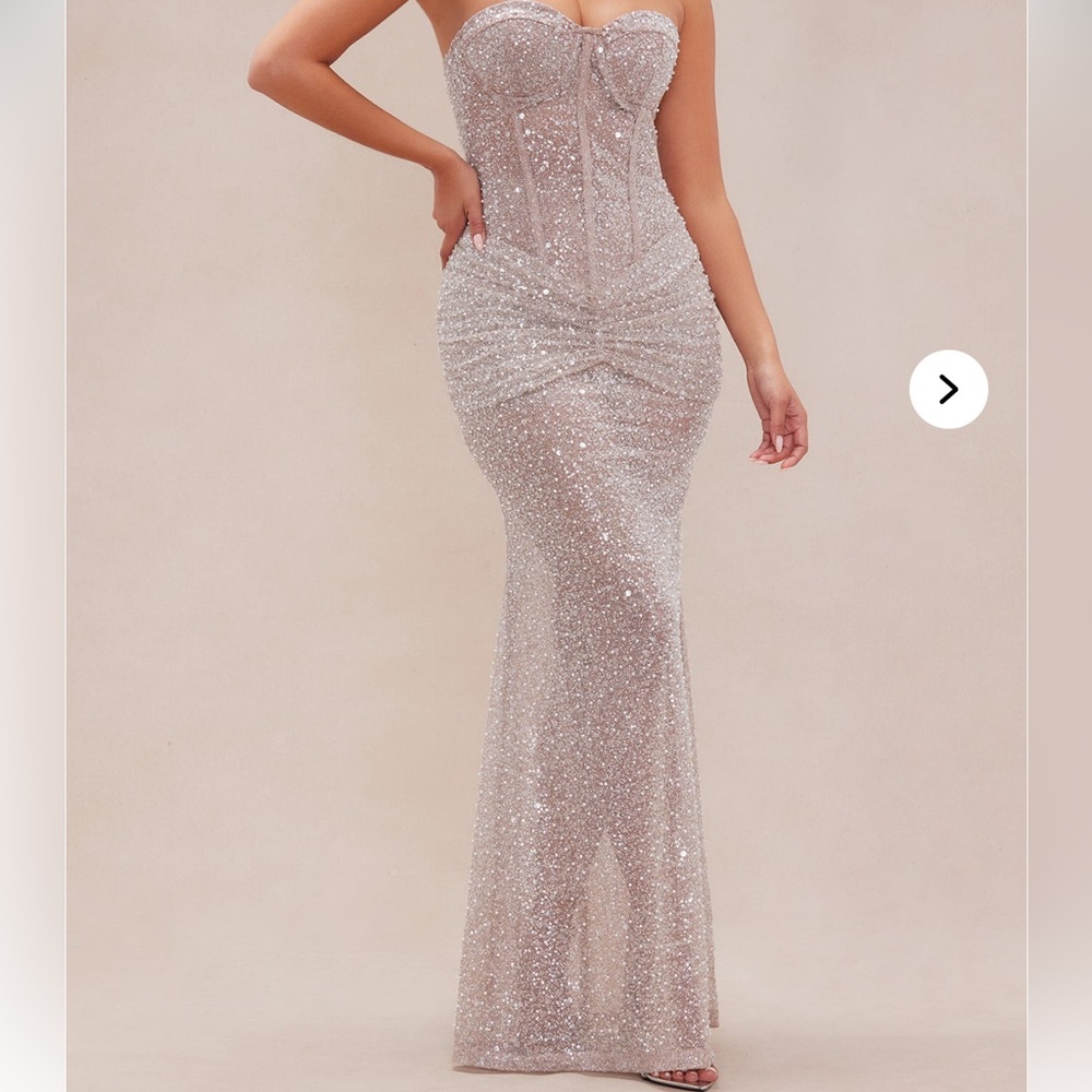 Elegant, strapless, nude dress.